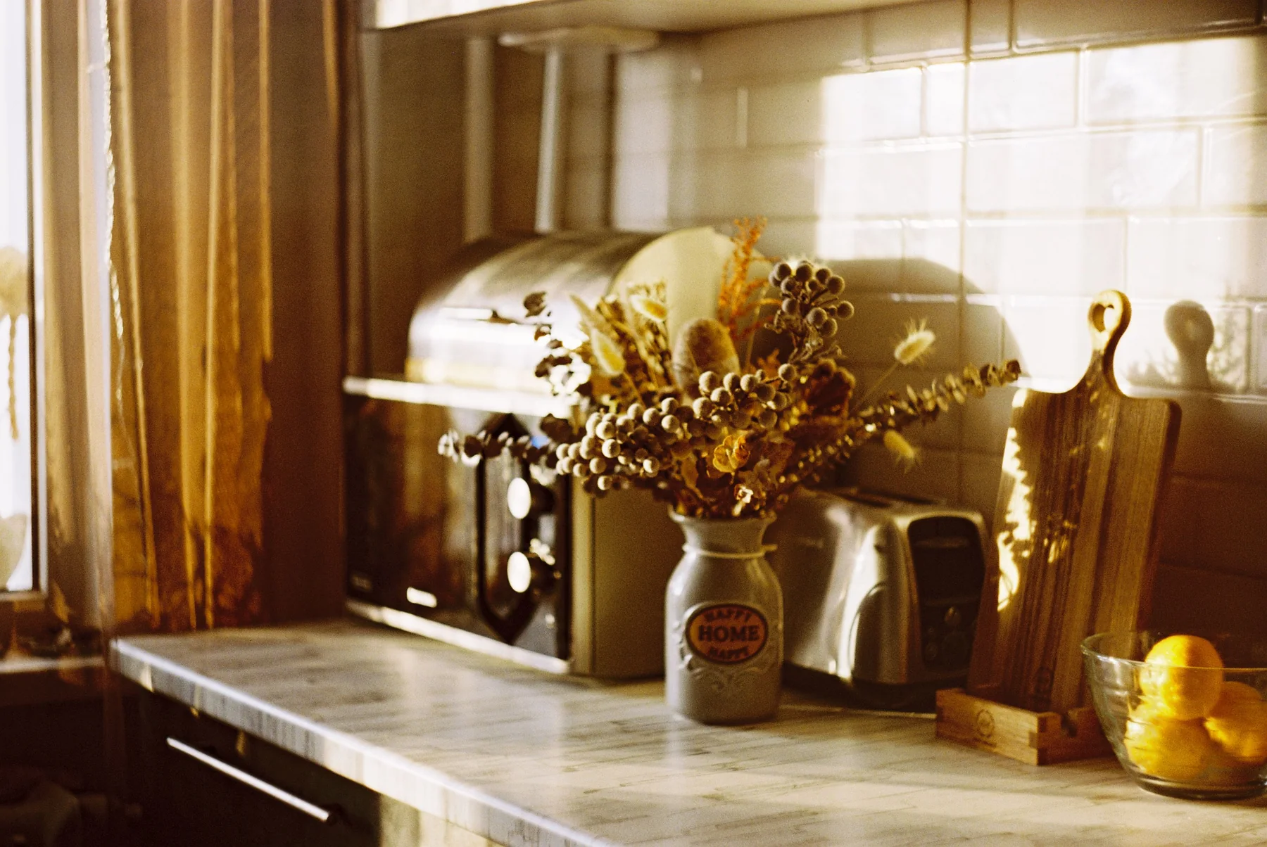 Kitchen counter with everyday appliances and home accessories