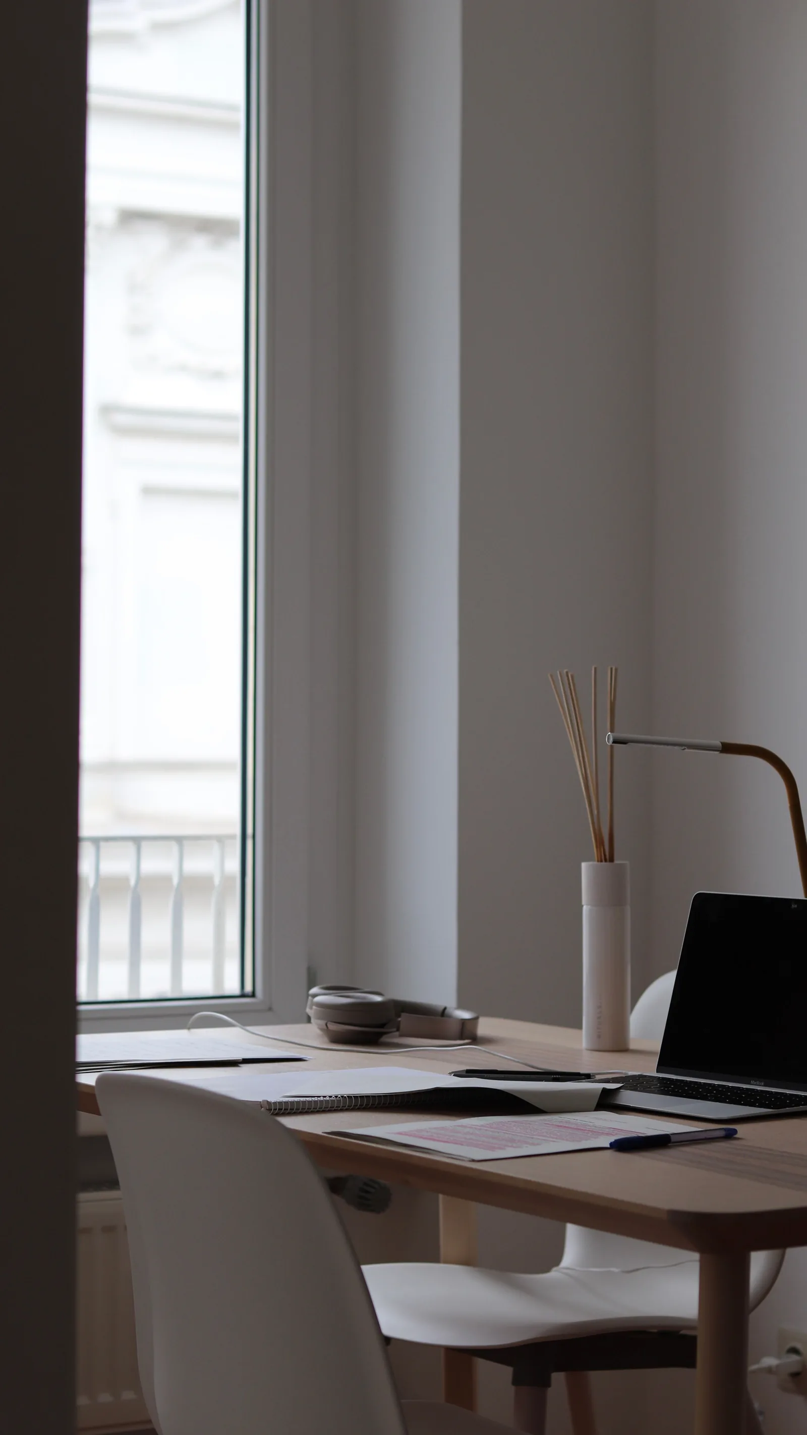 Home workspace with laptop, notebook and desk accessories